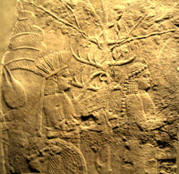 Two ritual performers attend a royal lion hunt.